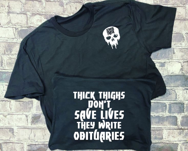 THICK THIGHS DONT'T SAE LIVES THEY WRITE OBITUARIES - T-SHIRT