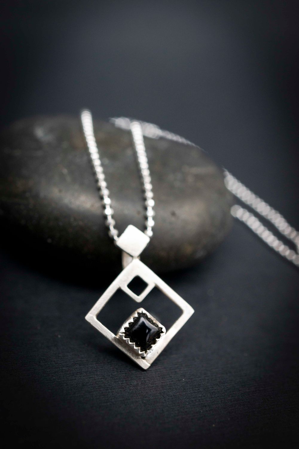 Meet our Onyx Silver pendant that is just under 1 inch square.