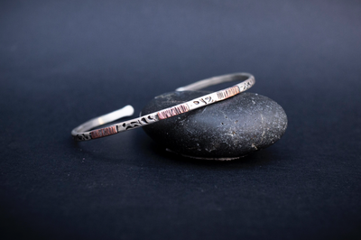 Mixed Metal Cuff Bracelet for Men.  Handmade in the Honey Bee Metals Studio.  It is textured sterling silver with copper accents.