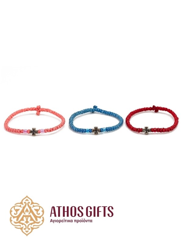 Handmade bracelets with a silver cross.