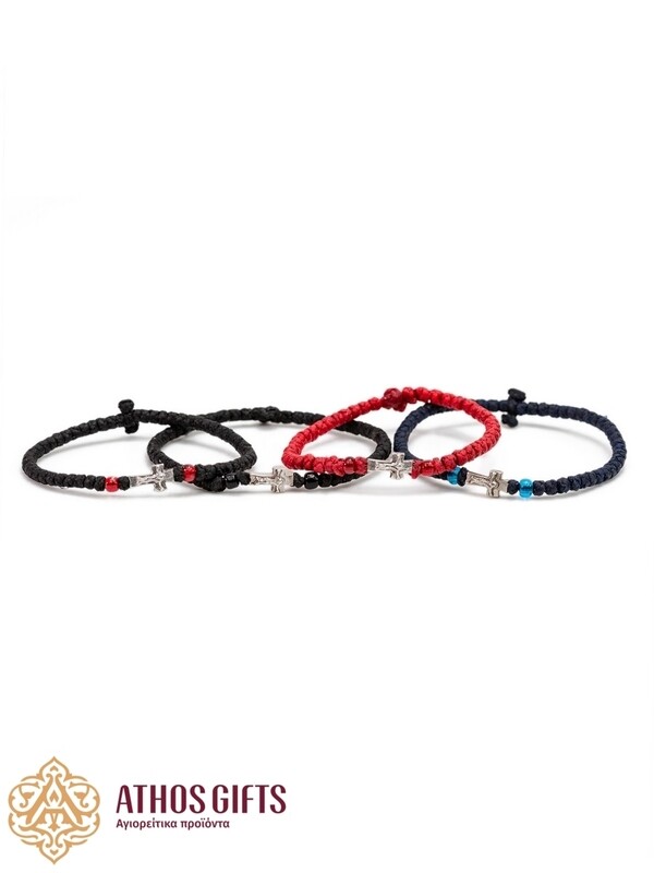 Handmade bracelets with a silver cross.