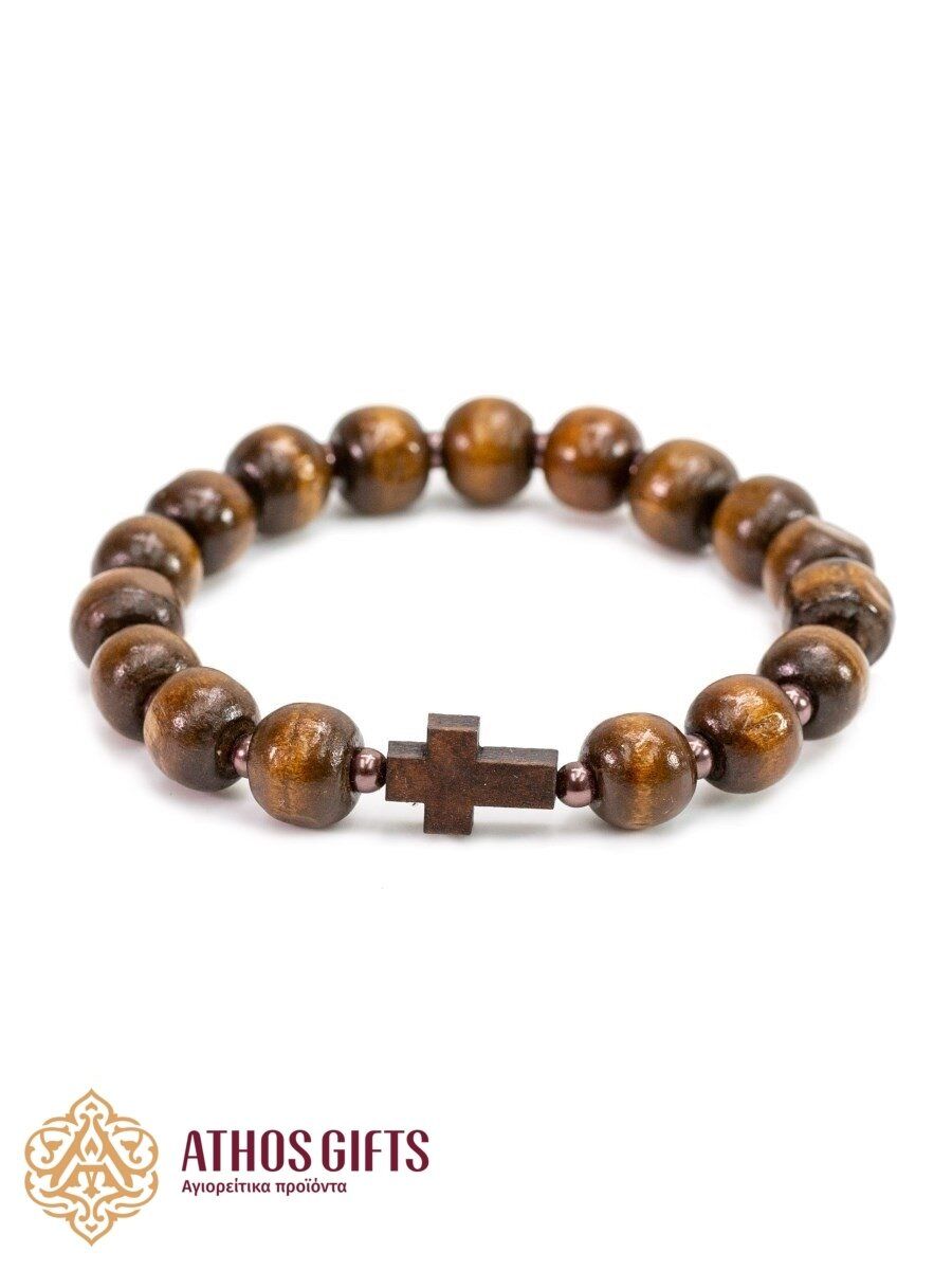 Handmade light wooden bracelet with a cross.
