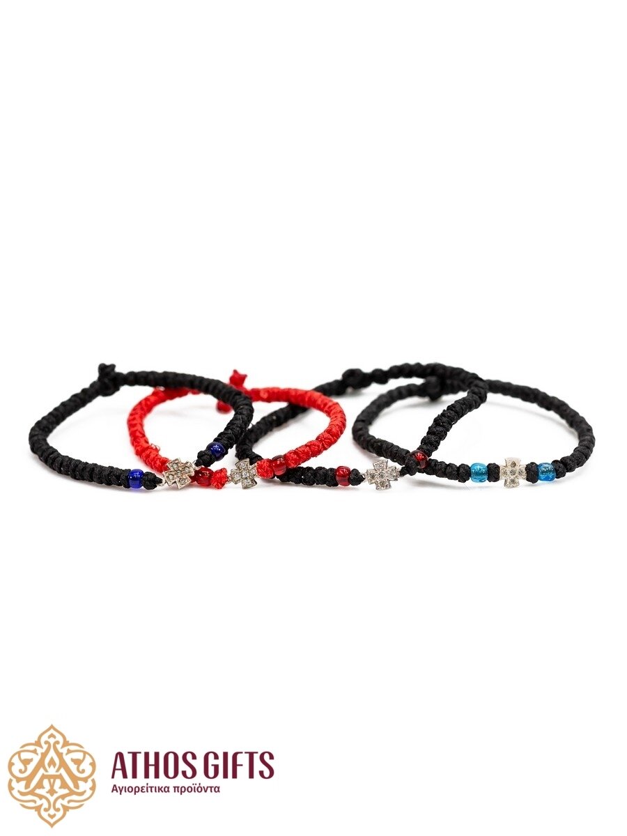 Handmade bracelets with a silver cross.