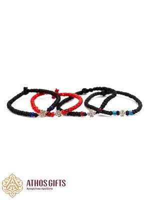 Handmade bracelets with a silver cross.