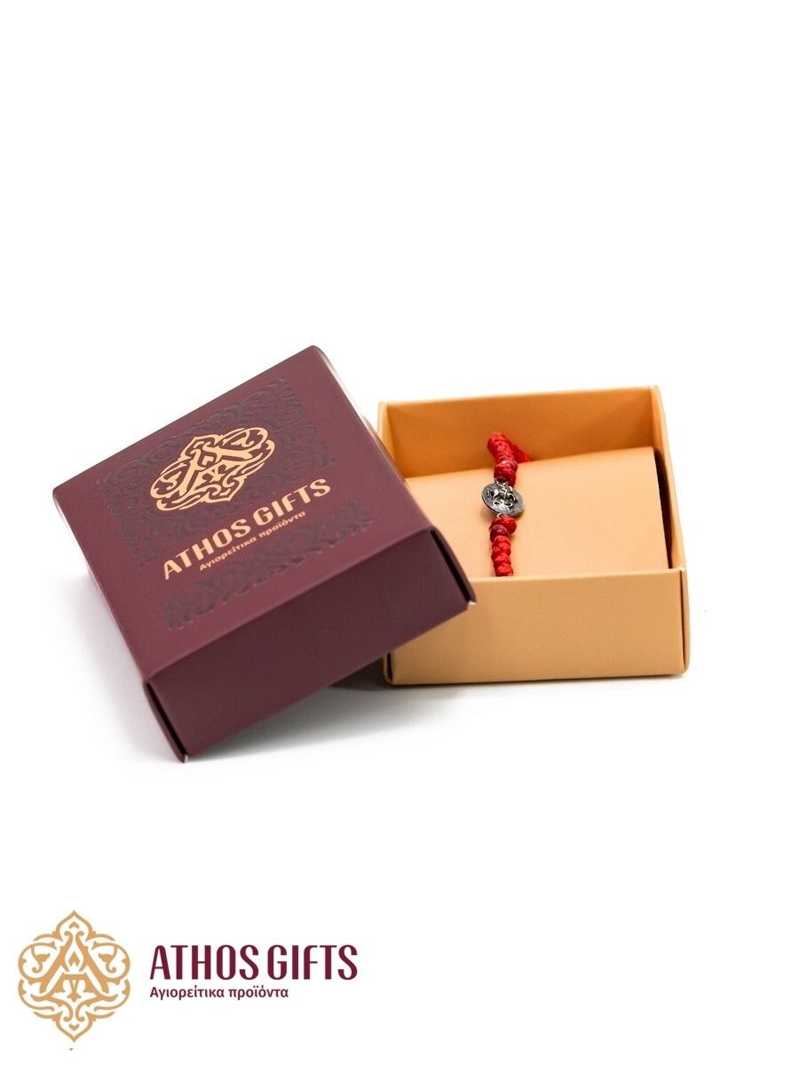 Handmade red bracelet with an icon of Saint George.