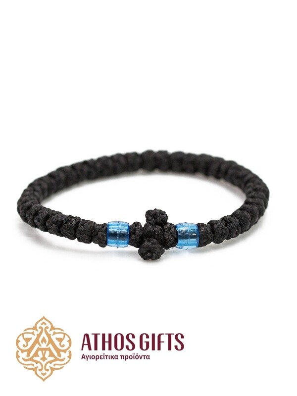 Orthodox woven bracelet with a cross and blue beads.