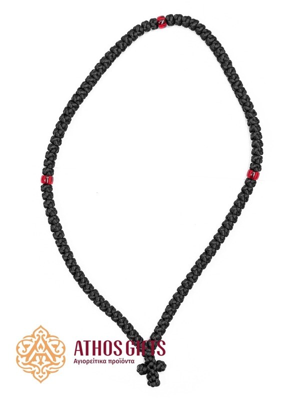 Handmade woven prayer rope with 100 knots and red bead inserts.