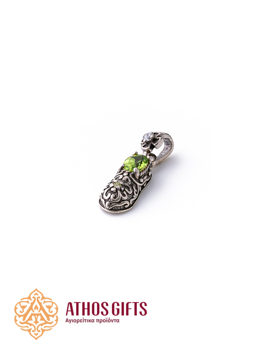 Silver pendant in the shape of Saint Spyridon’s slipper with a green rhinestone.