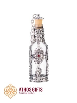Bottle for holy water decorated around the perimeter with a metal ornament in Byzantine style