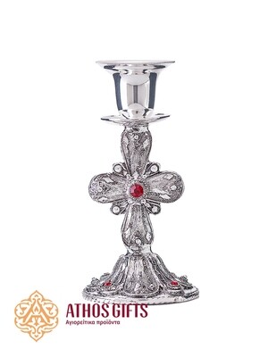Metal candle holder with a carved cross adorned with a red rhinestone