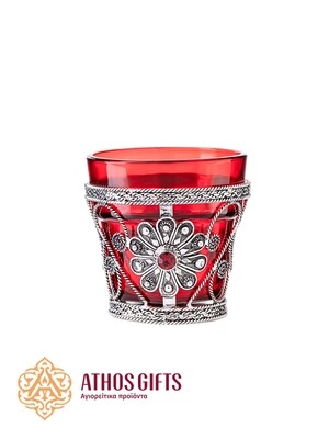 Table oil lamp for home use, made of red glass in a metal frame.