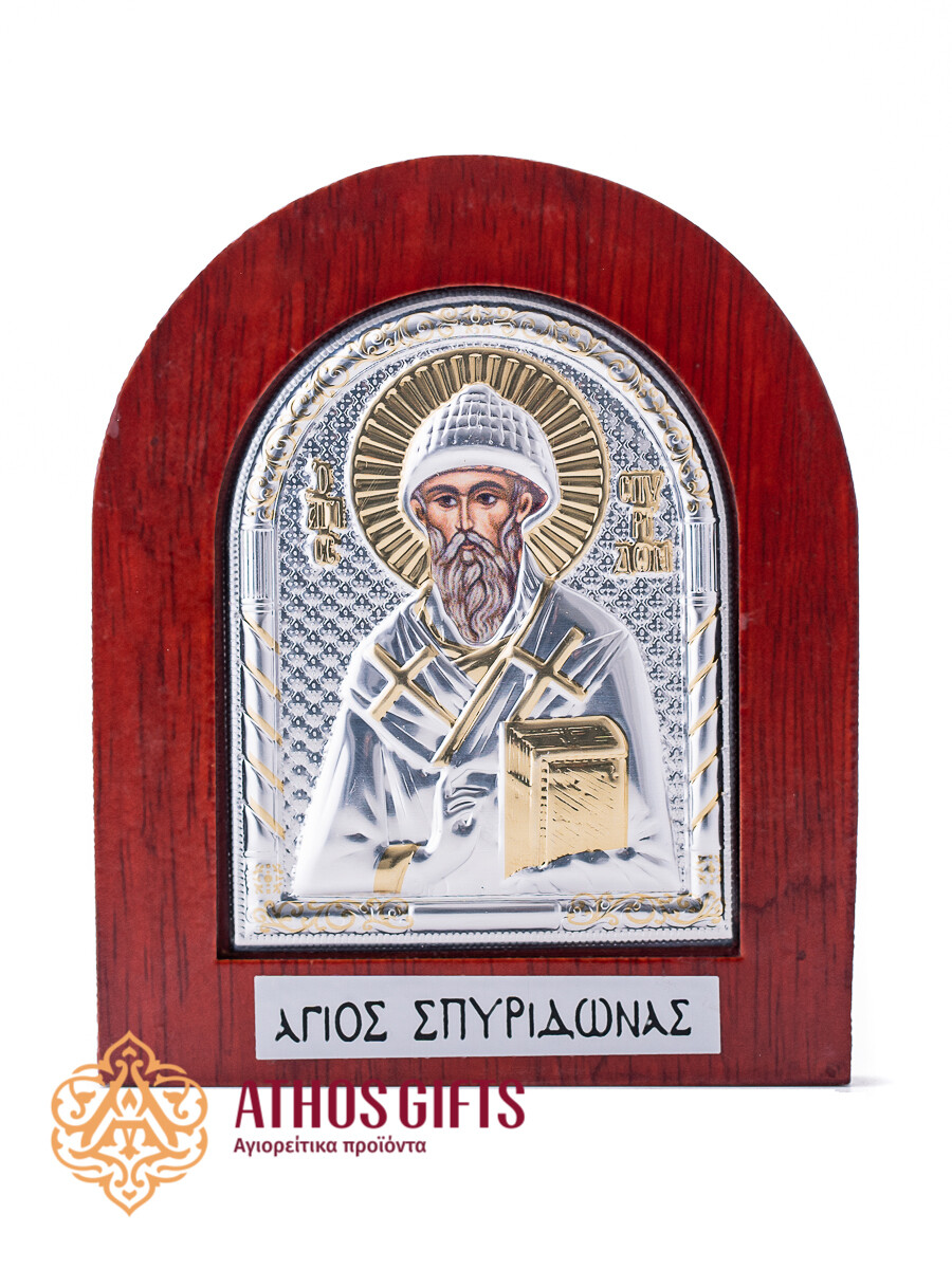 Saint Spyridon metal icon in a wooden frame.