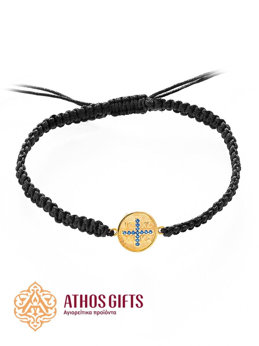 Braided bracelet with a gold-plated silver insert featuring a cross adorned with blue rhinestones