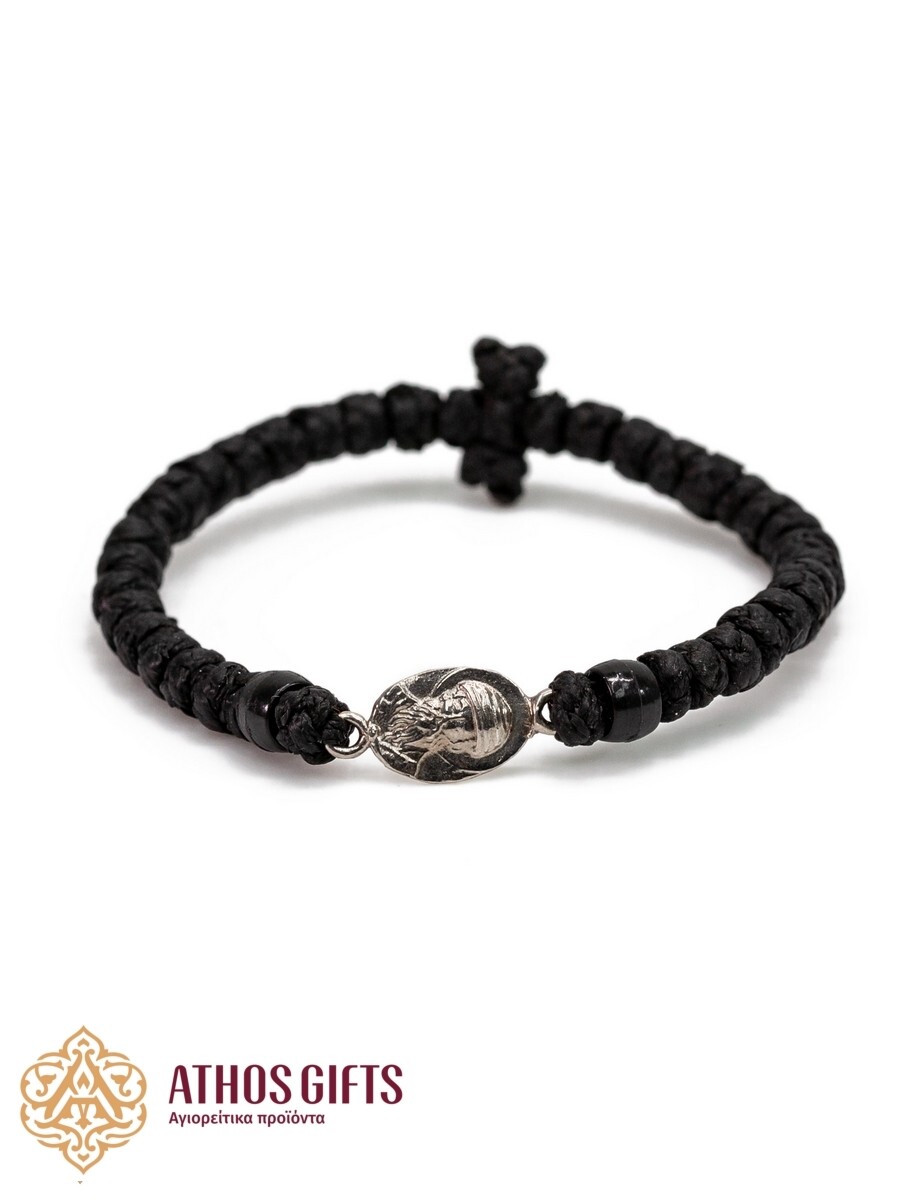 Woven bracelet with interwoven black beads and a silver icon of Saint Spyridon
