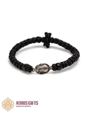 Woven bracelet with interwoven black beads and a silver icon of Saint Spyridon