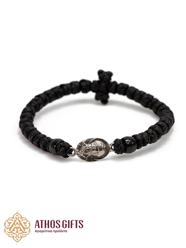 Woven bracelet with interwoven black beads and a silver icon of Saint Spyridon