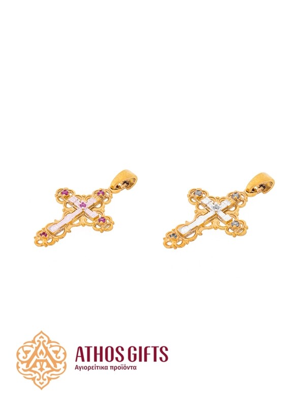 A cross pendant for the neck made of silver with gilding.