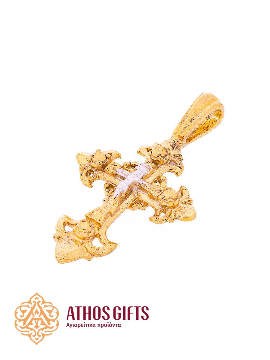 A cross pendant for the neck made of silver with gilding.