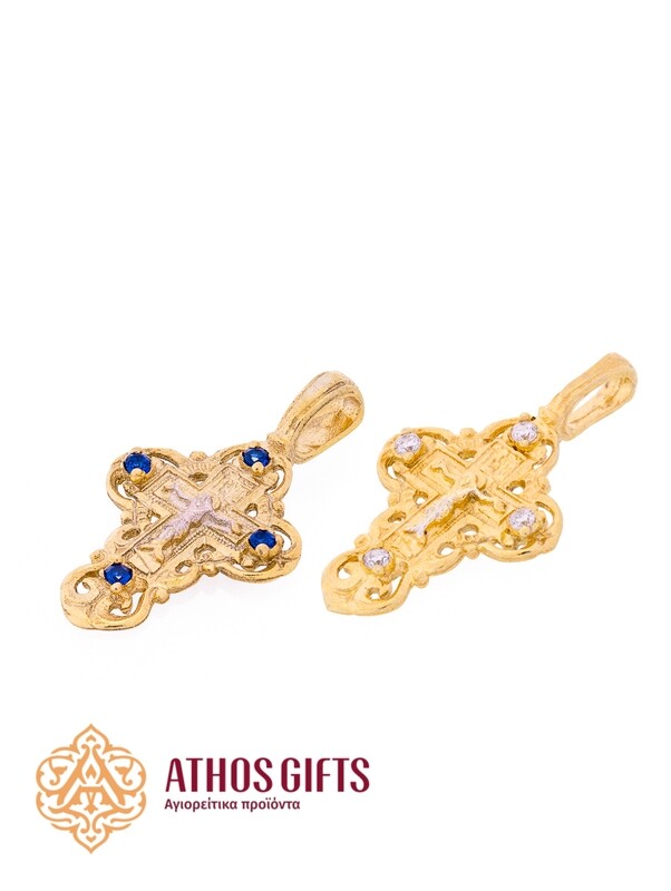 A cross pendant for the neck made of silver with gilding.