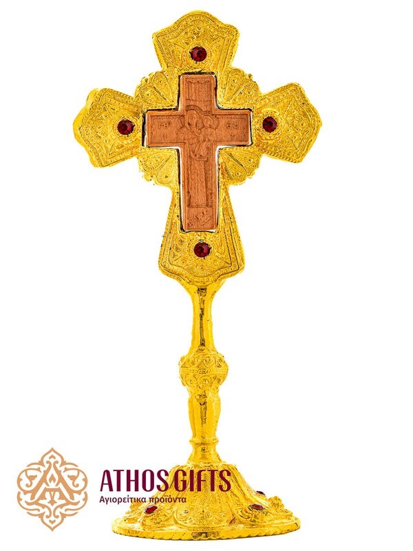 Ceramic tabletop cross in a metal frame with red beads.