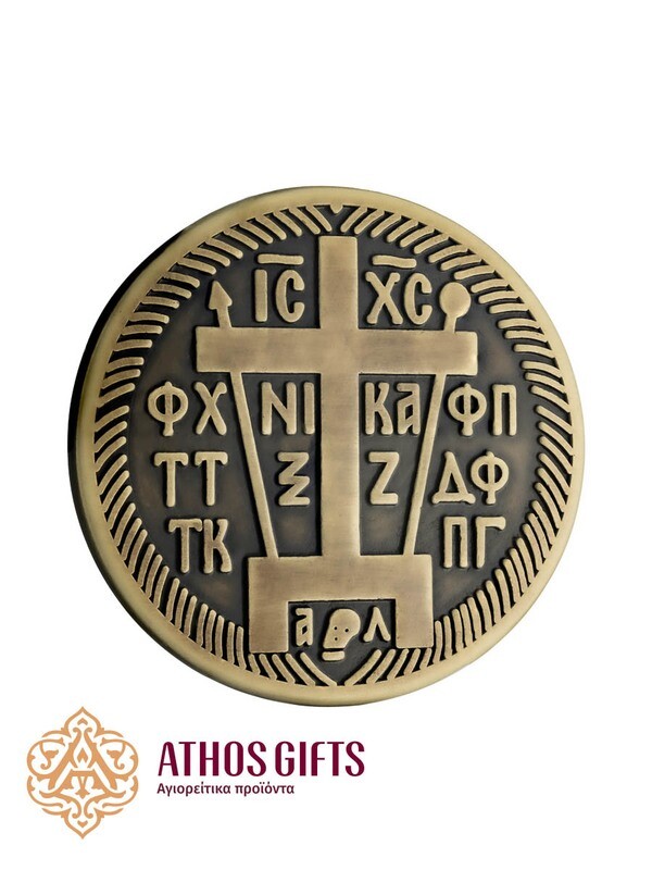 Metal belt buckle with an image of a schemamonk’s cross.