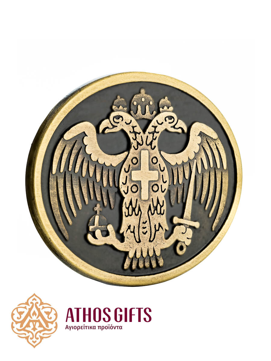 Metal belt buckle with an engraved image of the Byzantine double-headed eagle.