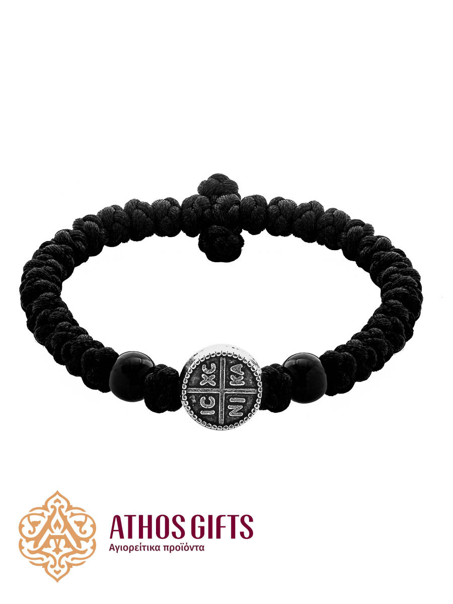 Braided bracelet with a metal insert and black beads