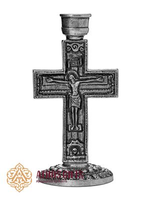 Silver-colored metal cross-shaped candle holder with images of the Crucifixion and the Mother of God