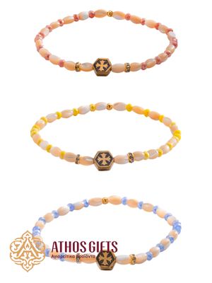Bracelet made of plastic beads with metal inserts woven into it featuring an equal-armed cross