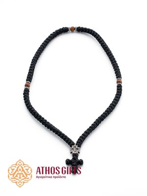 Prayer rope with a braided cross, a metal insert with the image of the Mother of God, and wooden beads