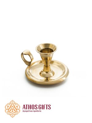 Metal candle holder for one candle on a wide base with a gold-colored handle.