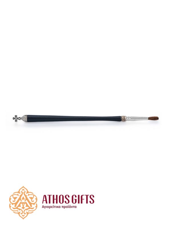 An anointing brush made of solid wood, decorated with decorative elements.