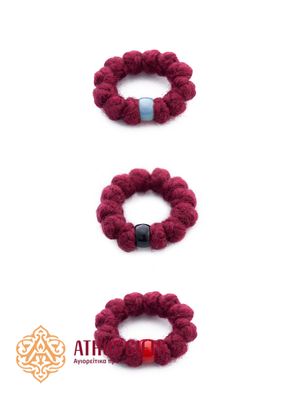 Wool prayer ring-rope made of wool. It consists of 12 knots and a plastic rhinestone.