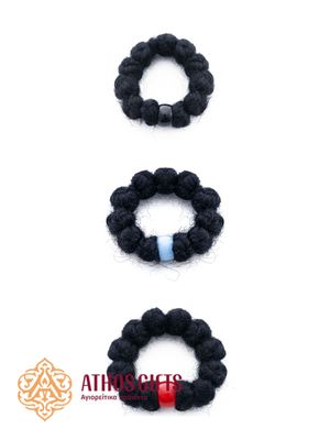 Black wool prayer ring-rope with a black rhinestone. It consists of 12 knots.