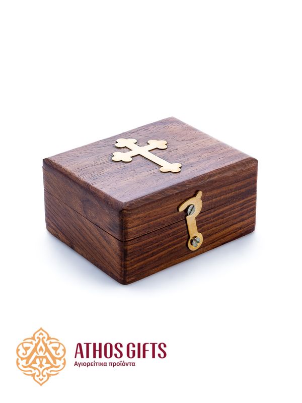 A box made of natural dark wood, decorated with a metal cross.