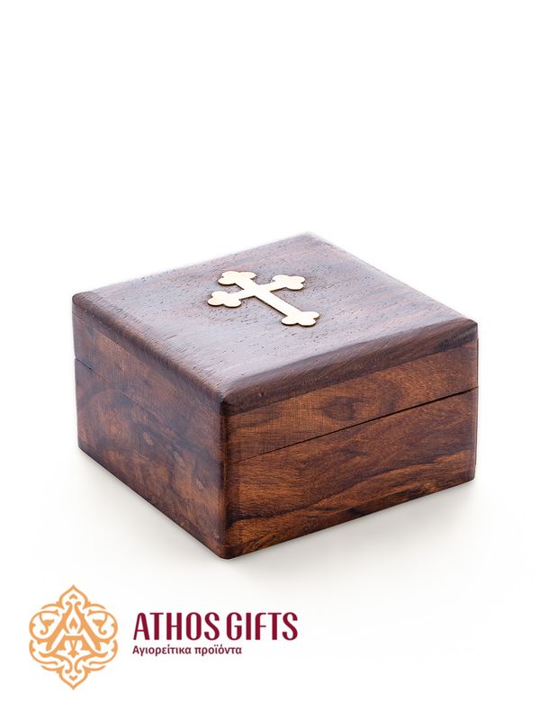 A box made of natural dark wood, decorated with a metal cross.