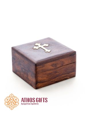 A box made of natural dark wood, decorated with a metal cross.