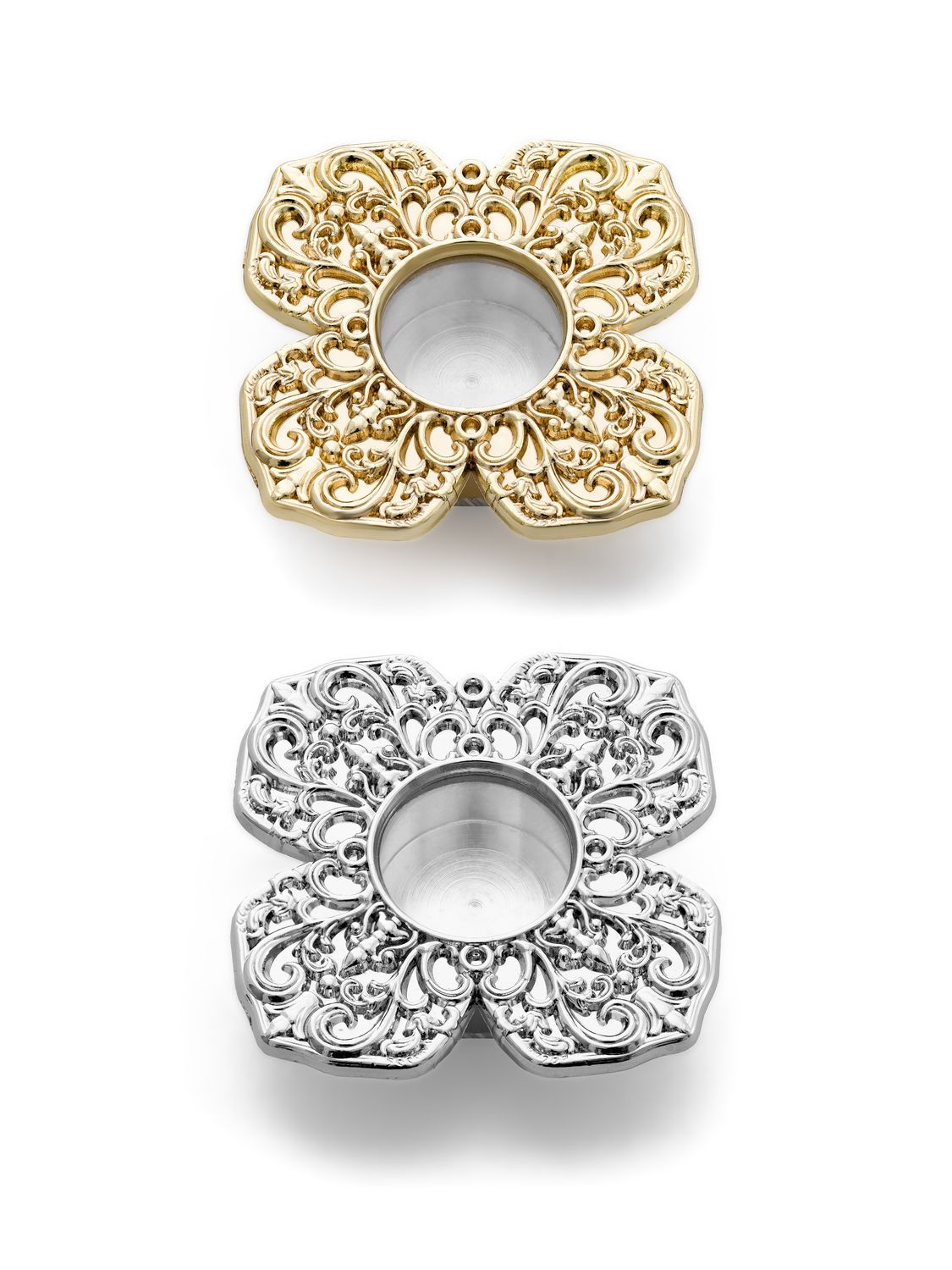 A miniature metal reliquary with a viewing window, decorated with a floral ornament.