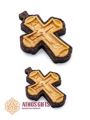 Carved wooden cross made of boxwood, placed in a frame of dark walnut wood.