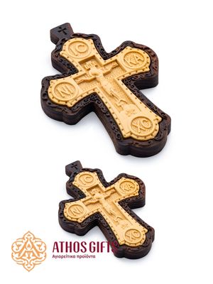 Carved wooden cross made of boxwood, placed in a frame of dark walnut wood.