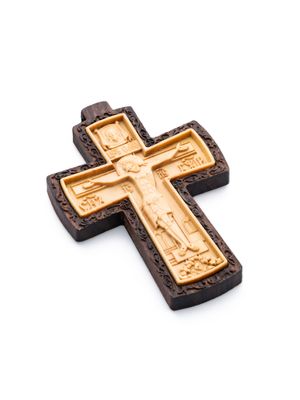 Carved wooden cross made of boxwood, placed in a frame of dark walnut wood.