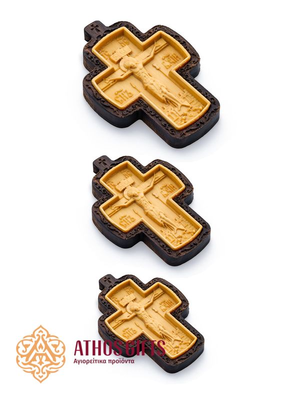 Carved wooden cross made of boxwood, placed in a frame of dark walnut wood.