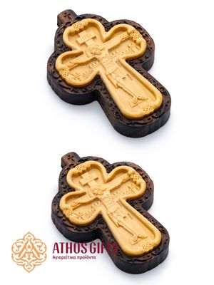 Carved wooden cross made of boxwood, placed in a frame of dark walnut wood.