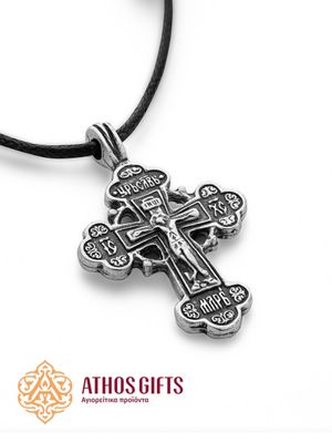 Metal cross pendant on a cord with the image of the Crucifixion of our Lord Jesus Christ.
