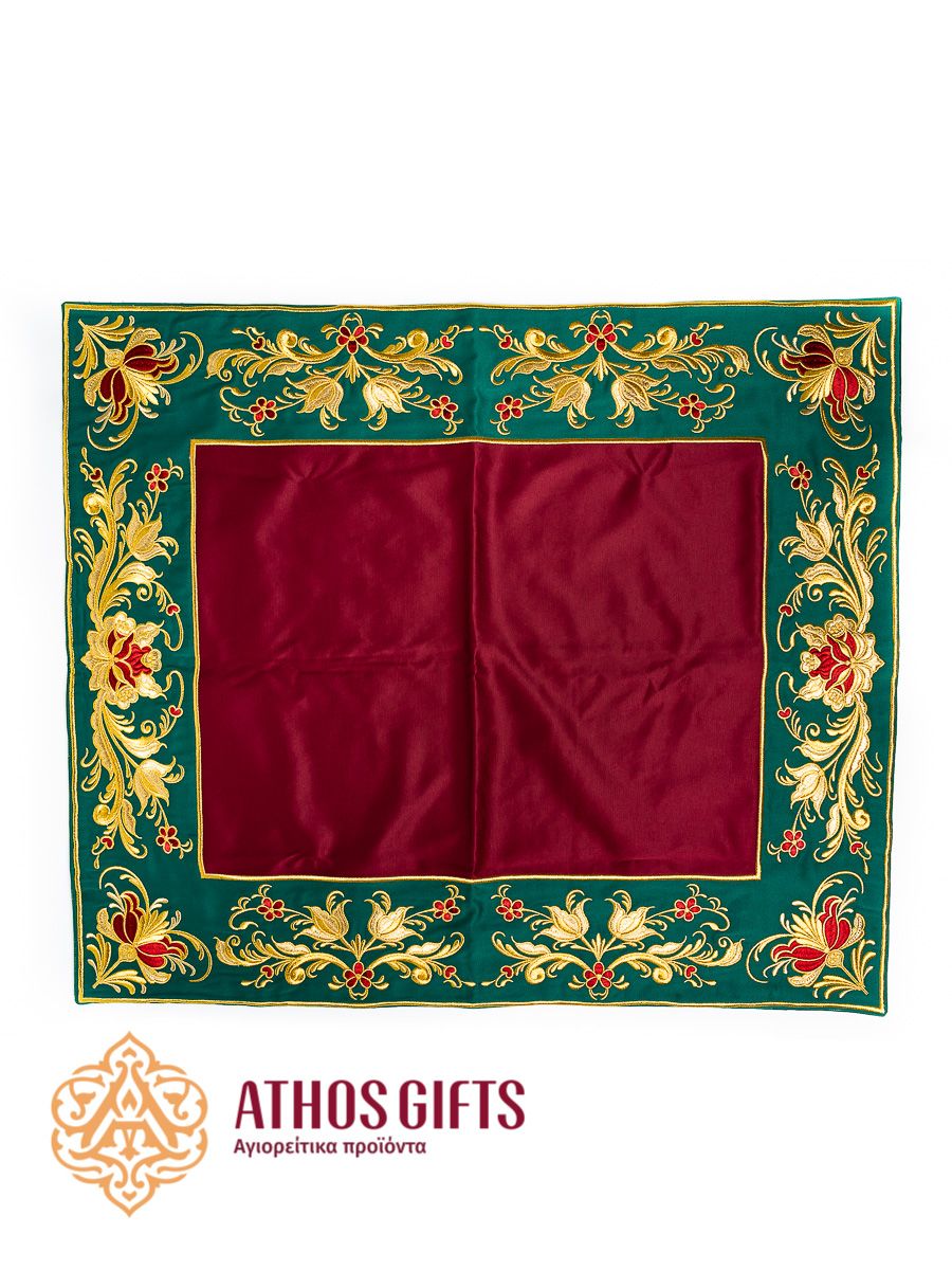 An iliton made of satin in burgundy color with green edging, embroidered with a floral ornament.