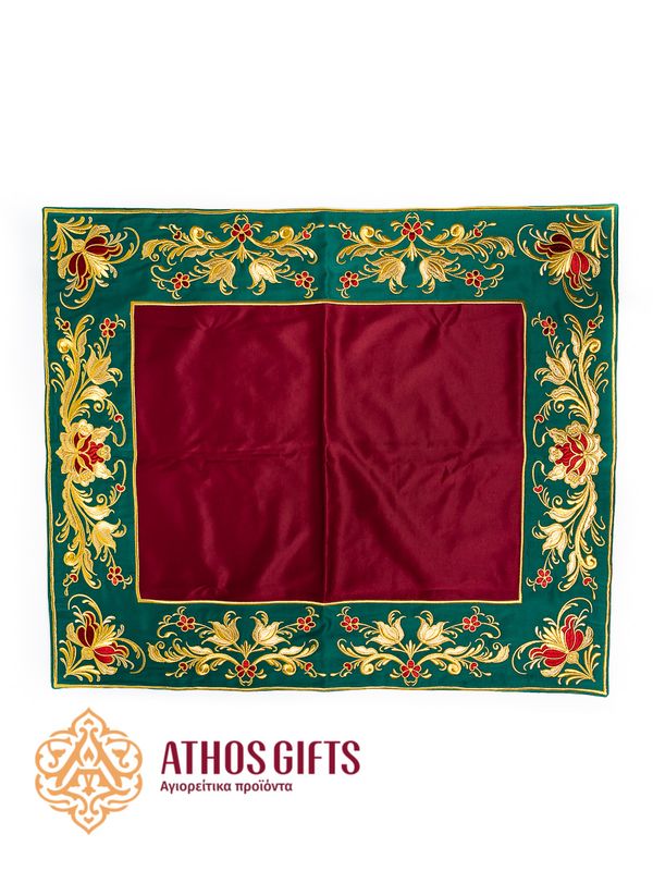 An iliton made of satin in burgundy color with green edging, embroidered with a floral ornament.
