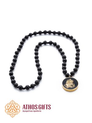 Prayer beads made of black wooden beads with a relief metal image of Saint George.
