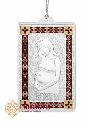 Metal tama with an image of a pregnant woman.