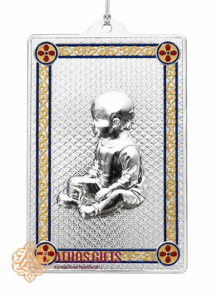 Metal tama with an image of a baby.