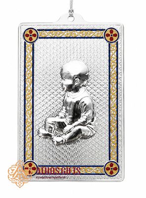 Metal tama with an image of a baby.